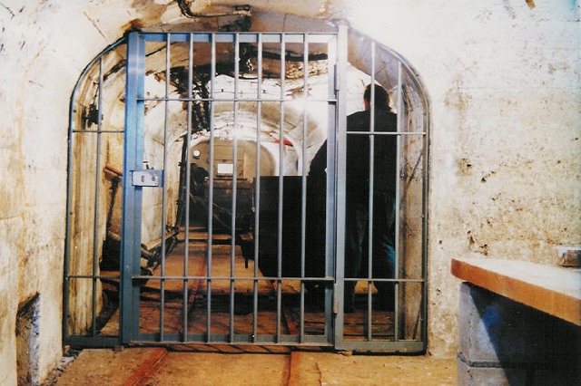 A heavy iron gate in a tunnel underground !