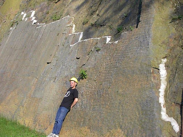 In front of a smooth rockface !